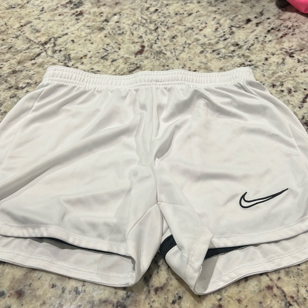 White Nike shorts
